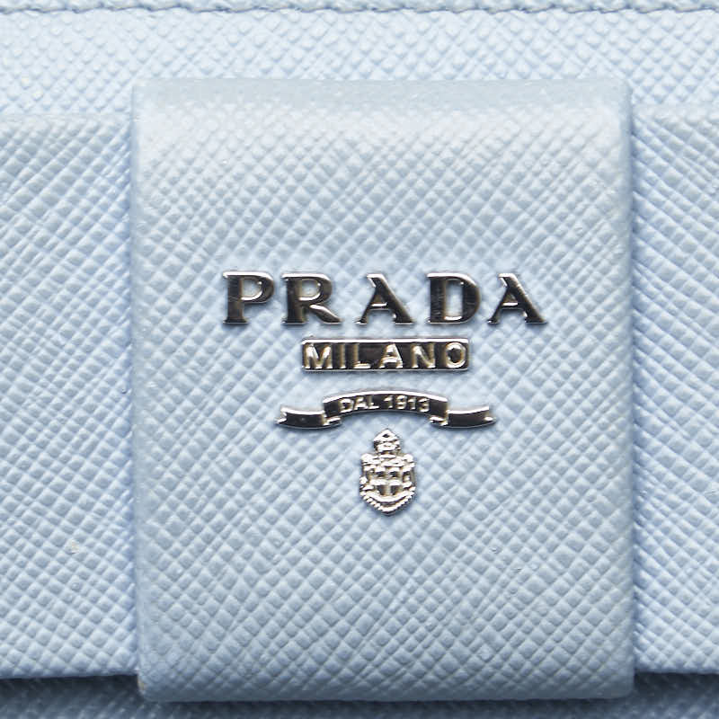 プラダ フィオッコ リボンモチーフ L字ファスナー 長財布 1ML183 ライトブルー サフィアーノレザー レディース PRADA 【中古】